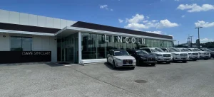 Lincoln dealership showroom in St. Peters, MO with new luxury vehicles on display.