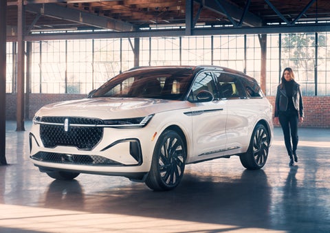 A person approaches a 2024 Lincoln Nautilus® SUV. | Dave Sinclair Lincoln St. Peters in Saint Peters MO