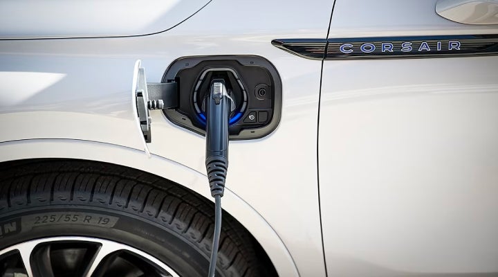 An electric charger is shown plugged into the charging port of a Lincoln Corsair® Grand Touring
model. | Dave Sinclair Lincoln St. Peters in Saint Peters MO