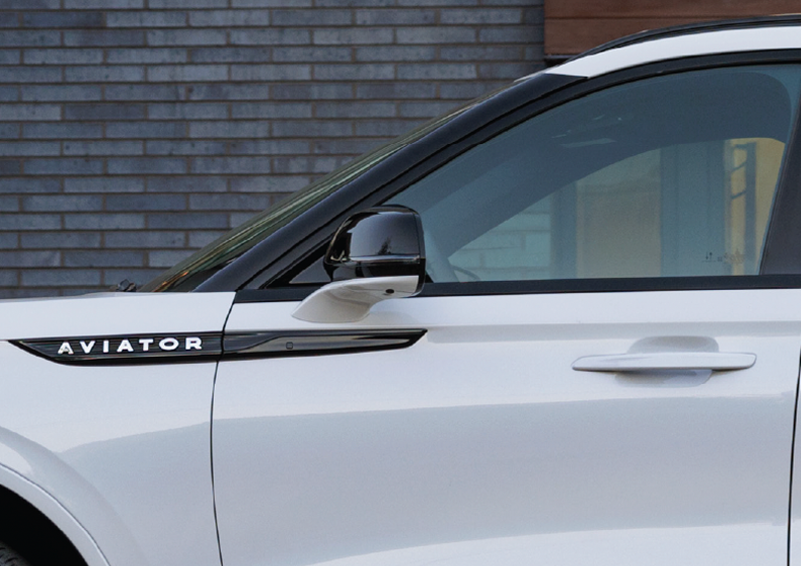 The driver’s door of a white 2025 Lincoln Aviator® SUV is showcased. | Dave Sinclair Lincoln St. Peters in Saint Peters MO