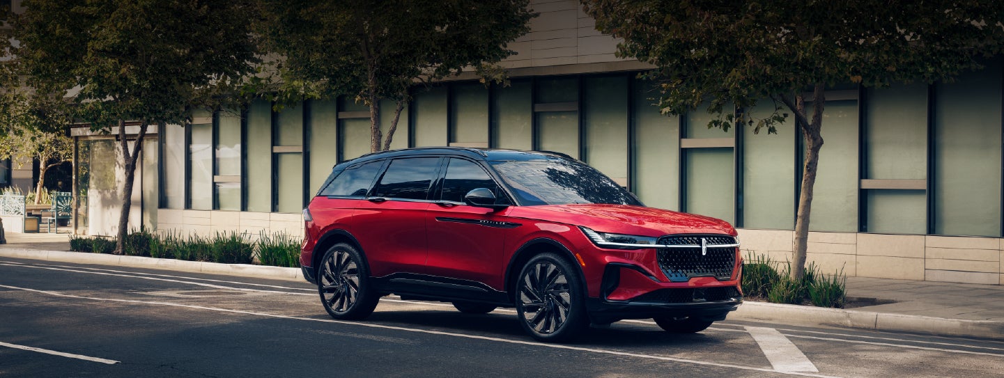 A 2025 Lincoln Nautilus® SUV with an available hybrid powertrain is parked in an urban setting. | Dave Sinclair Lincoln St. Peters in Saint Peters MO