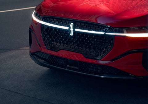 The available front LED light bar and center Lincoln Star logo glow at dusk. | Dave Sinclair Lincoln St. Peters in Saint Peters MO