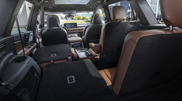 One side of the PowerFold® third-row seat and a second-row seat are folded forward in the 2026 Lincoln Aviator® SUV. | Dave Sinclair Lincoln St. Peters in Saint Peters MO