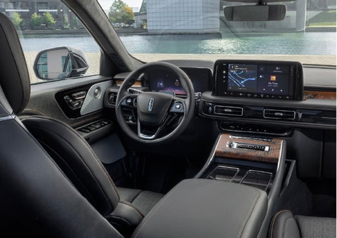 The interior of the 2026 Lincoln Aviator® SUV is shown parked with a view of a harbor through the windshield. | Dave Sinclair Lincoln St. Peters in Saint Peters MO