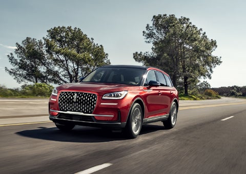 A 2026 Lincoln Corsair® SUV is shown being driven on a country road. | Dave Sinclair Lincoln St. Peters in Saint Peters MO