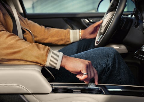 The driver of a 2026 Lincoln Corsair® SUV is shown selecting a drive mode. | Dave Sinclair Lincoln St. Peters in Saint Peters MO