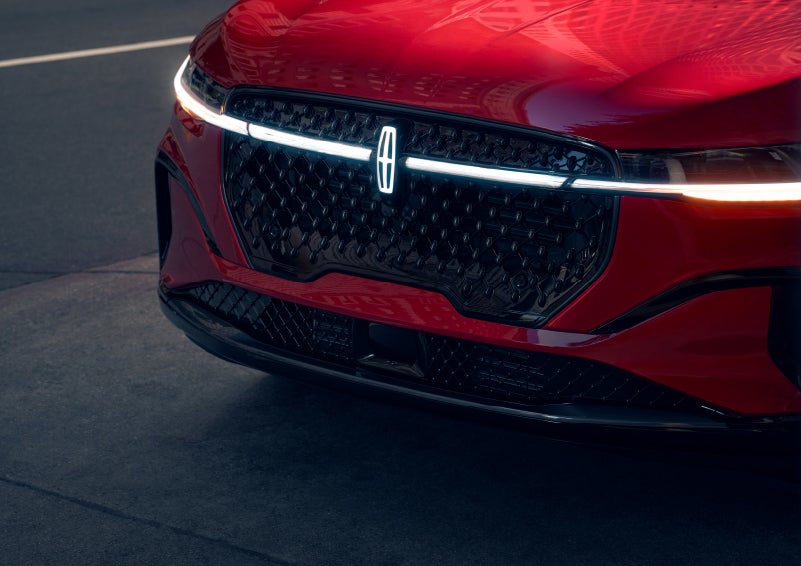 The available front LED light bar and center Lincoln Star logo glow at dusk. | Dave Sinclair Lincoln St. Peters in Saint Peters MO