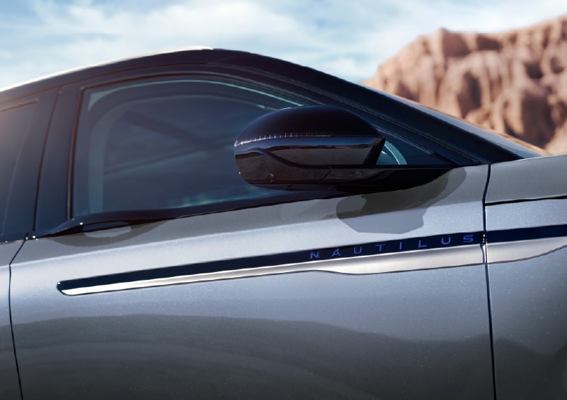 Blue lettering on the side of the vehicle that reads Nautilus indicates the available Hybrid Powertrain. | Dave Sinclair Lincoln St. Peters in Saint Peters MO