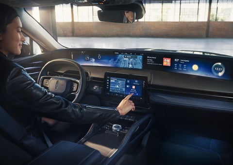 The driver of a 2026 Lincoln Nautilus® SUV interacts with the center touchscreen. | Dave Sinclair Lincoln St. Peters in Saint Peters MO