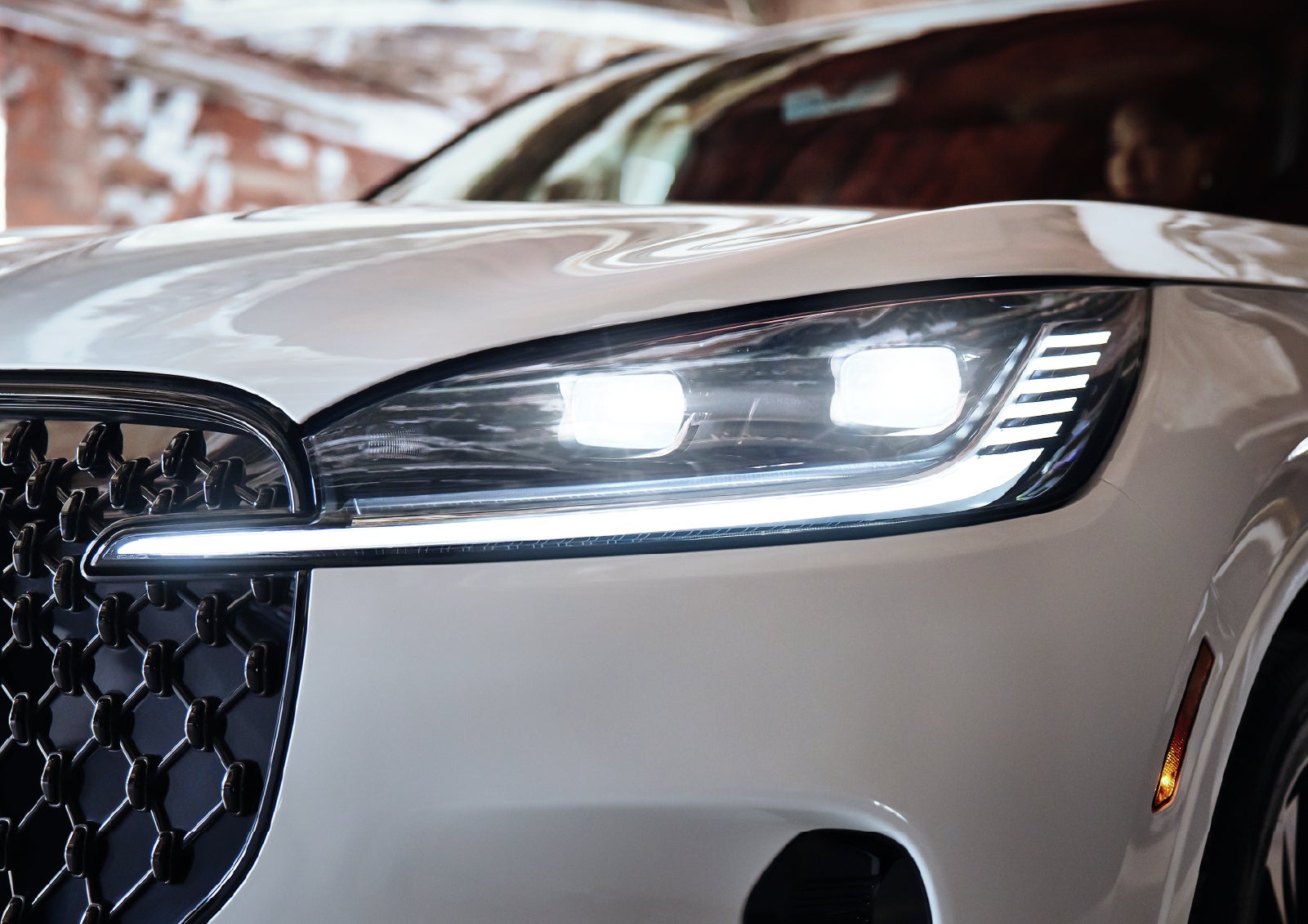 A close-up of a headlamp on the 2027 Lincoln Aviator® SUV is shown. | Dave Sinclair Lincoln St. Peters in Saint Peters MO