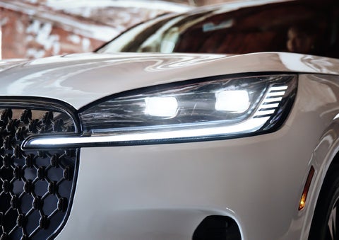 A close-up of a headlamp on the 2027 Lincoln Aviator® SUV is shown. | Dave Sinclair Lincoln St. Peters in Saint Peters MO