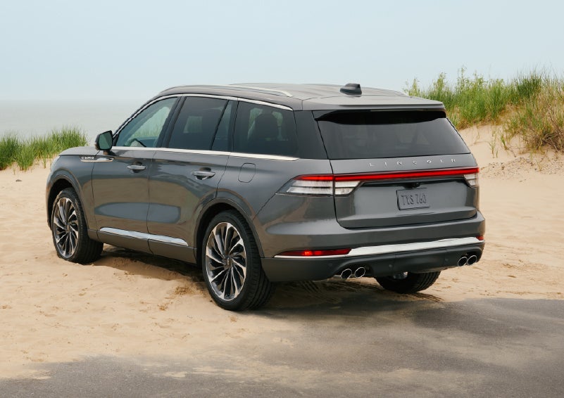 A 2027 Lincoln Aviator® SUV is parked next to sand dunes. | Dave Sinclair Lincoln St. Peters in Saint Peters MO