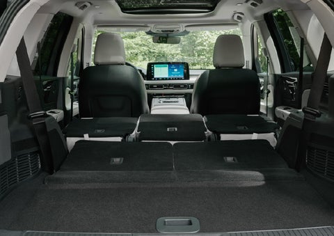 A rear to front view of the interior of a 2027 Lincoln Aviator® Black Label™ SUV shows the third and second rows folded flat | Dave Sinclair Lincoln St. Peters in Saint Peters MO