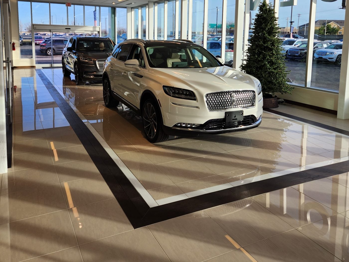 White Lincoln Nautilus on display in the bright showroom at Dave Sinclair Lincoln St. Peters