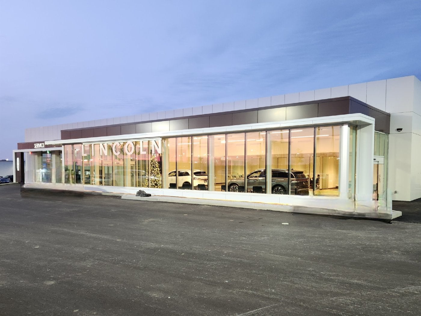 Exterior of the Dave Sinclair Lincoln St. Peters showroom and lot at dusk