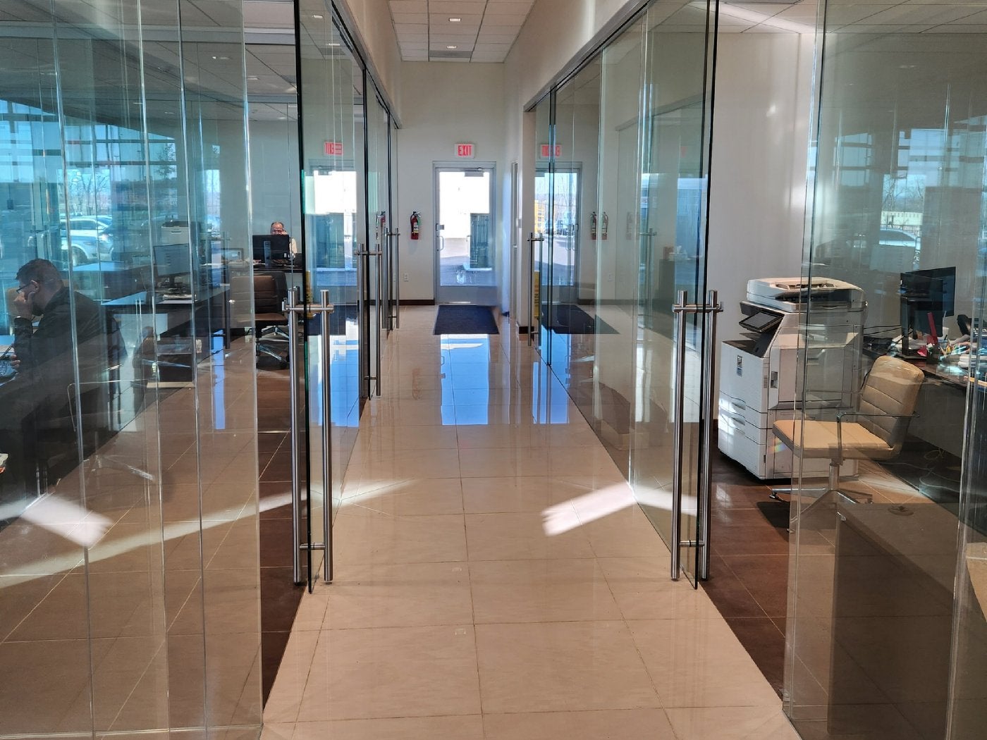 Glass walled offices along a bright hallway at Dave Sinclair Lincoln St. Peters
