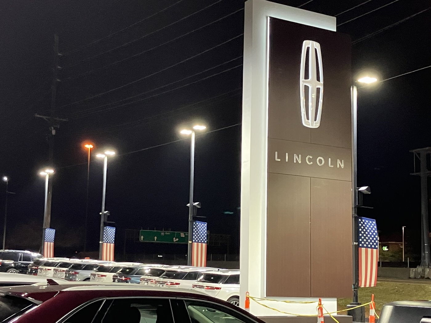 Lincoln star sign lit at night over the lot at Dave Sinclair Lincoln St. Peters